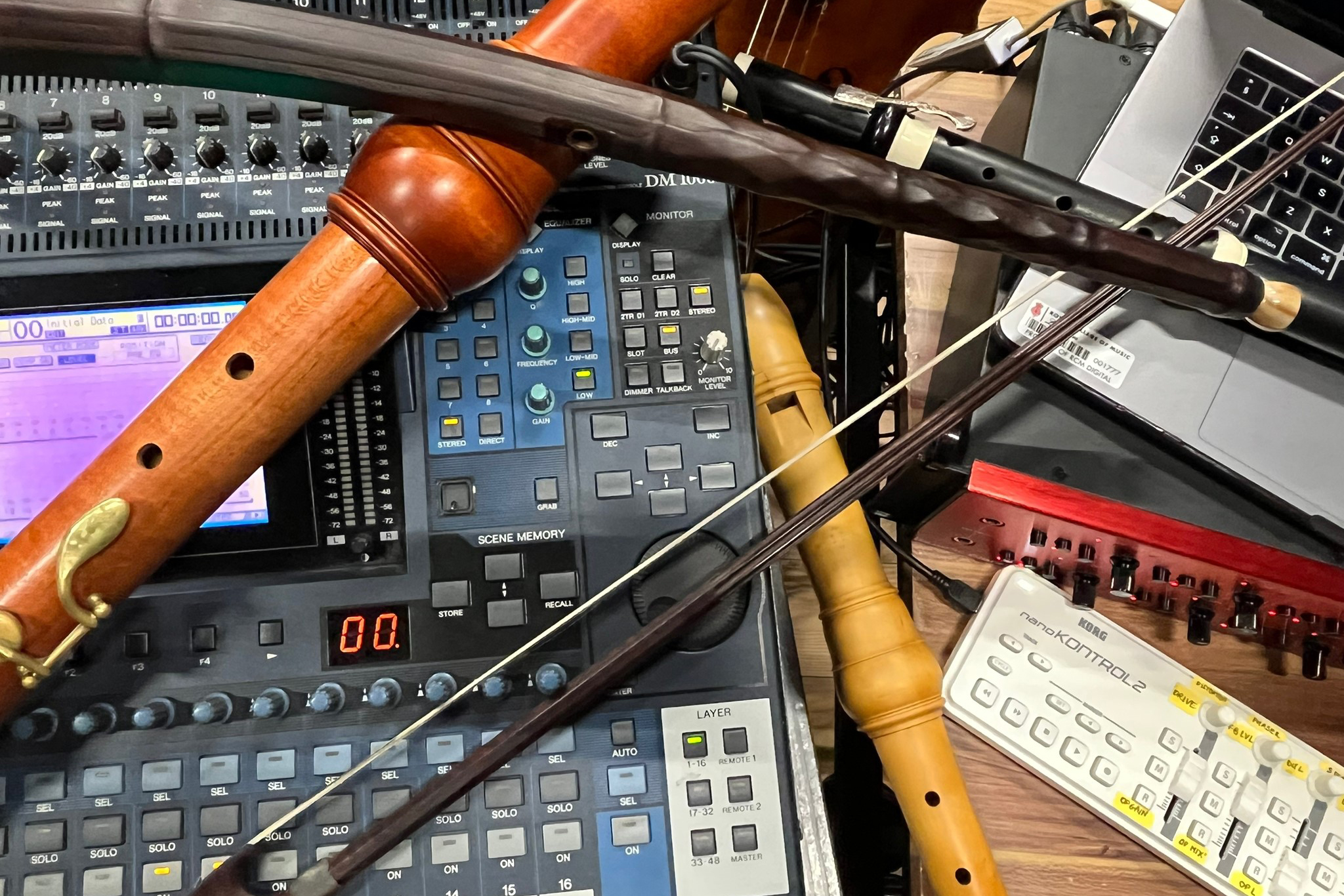 A photograph of historical instruments placed on top of electronic equipment
