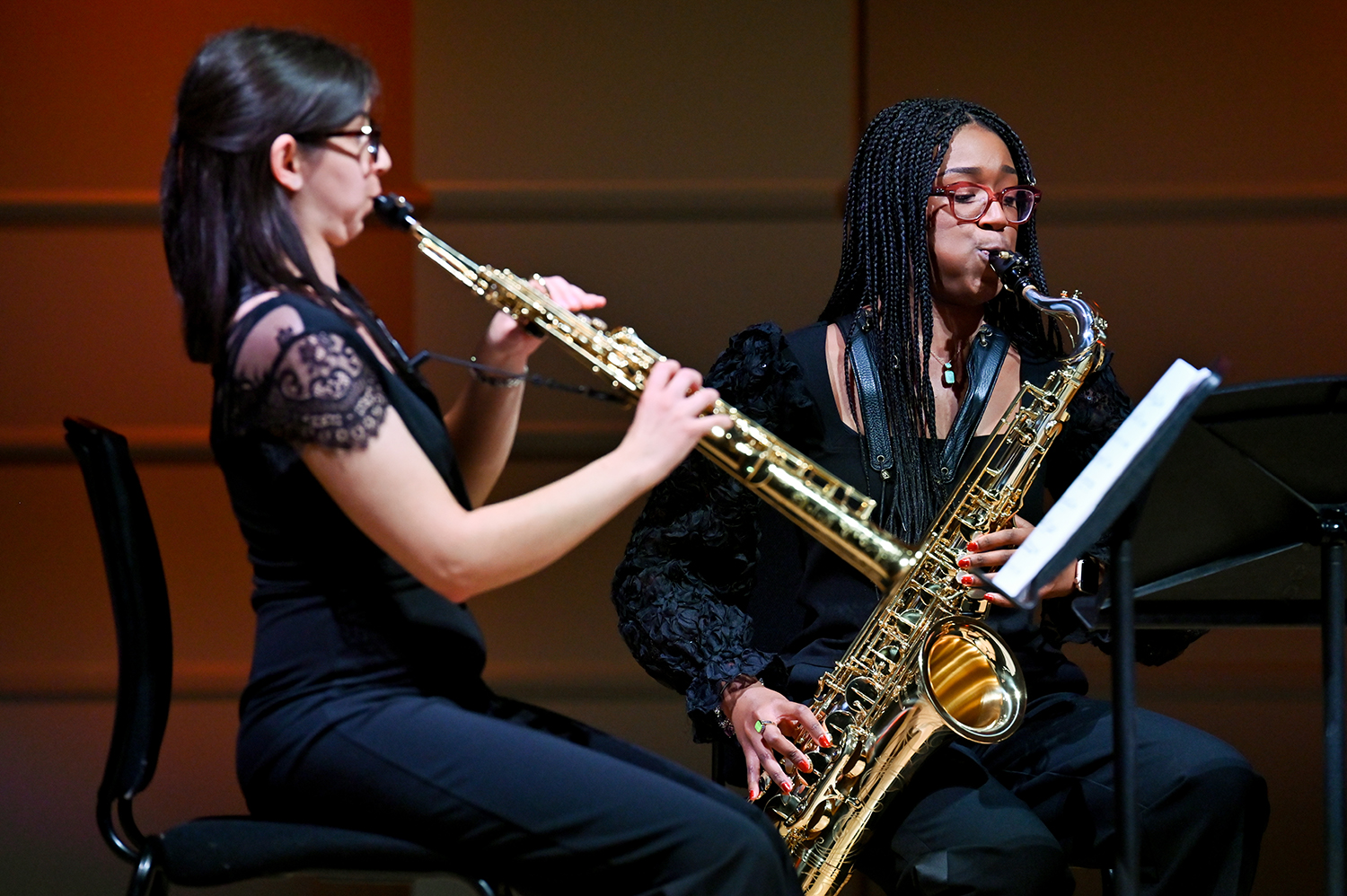 Two musicians performing on the saxophone in the Performance Hall